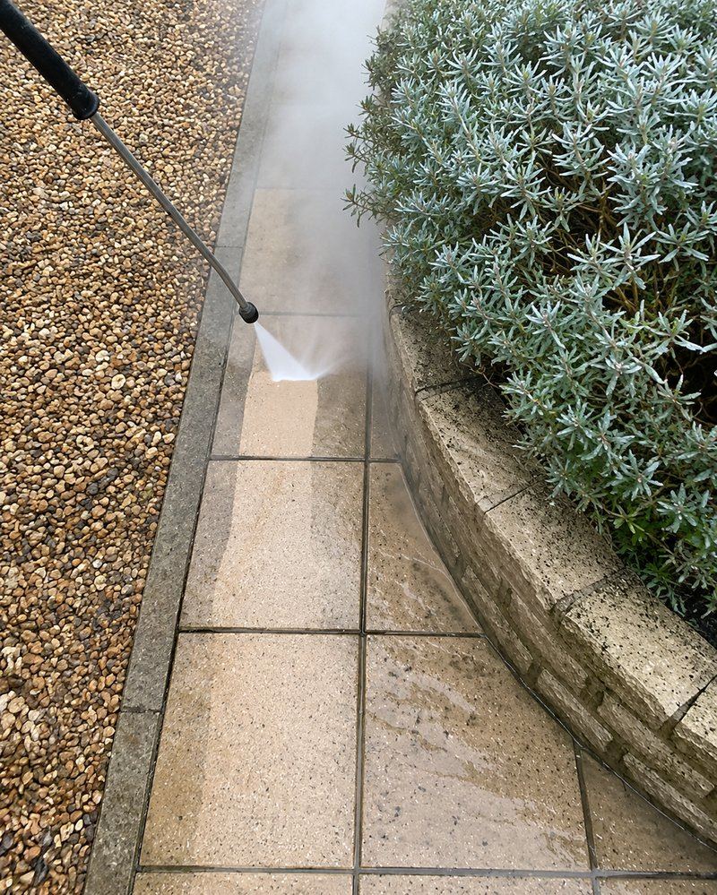 Pressure washing a garden path and patio in Oklahoma City